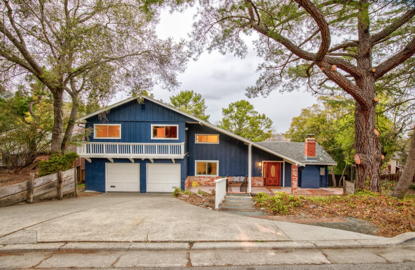865 Sunset Drive San Carlos, CA 94070 - Photo 26 of 26 a front view of a house with yard and trees in the background