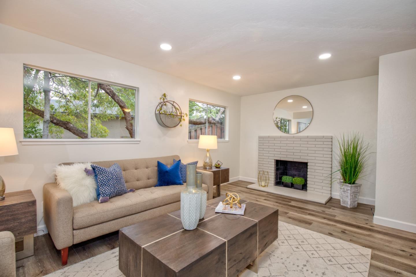 865 Sunset Drive San Carlos, CA 94070 - Photo 4 of 26 a living room with furniture and a fireplace