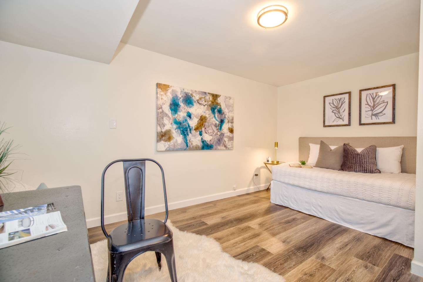 865 Sunset Drive San Carlos, CA 94070 - Photo 10 of 26 a living room with furniture and wall paintings