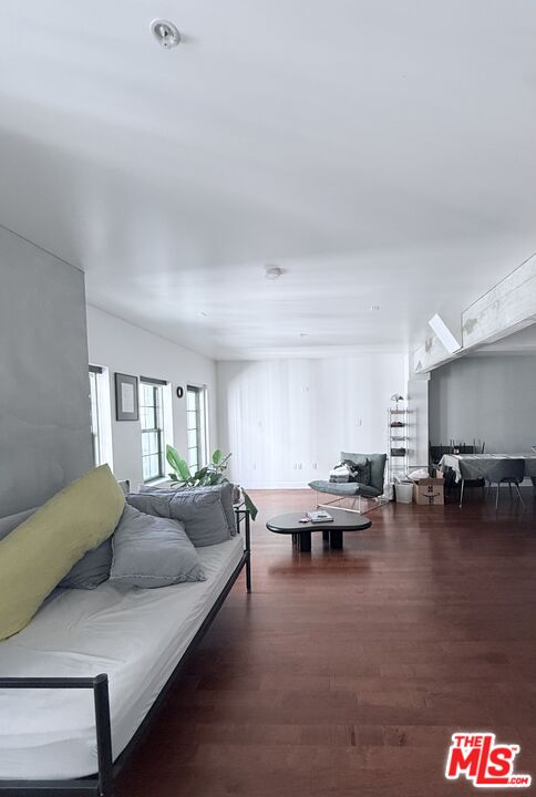 416 South Spring Street, Unit 905 Los Angeles, CA 90013 - Photo 7 of 19 a living room with furniture and a couch