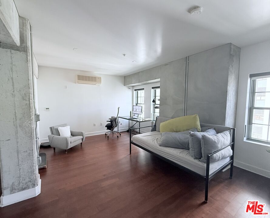 416 South Spring Street, Unit 905 Los Angeles, CA 90013 - Photo 8 of 19 a living room with furniture and a window