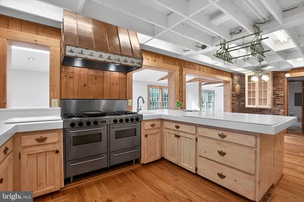 a kitchen that has a sink and a stove
