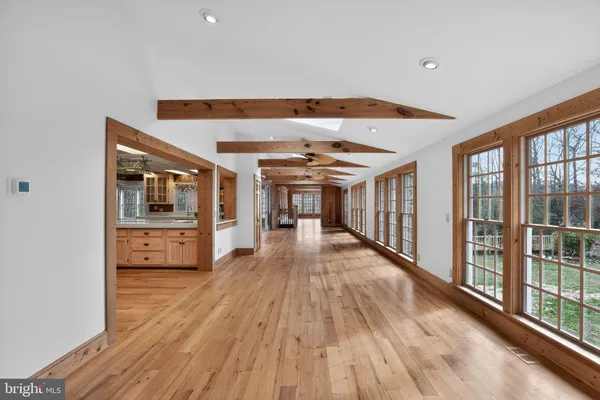 a bathroom with a sink a toilet and a window
