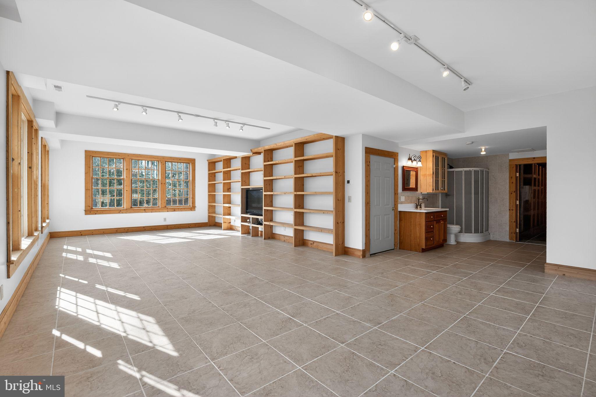 20045 Tower Hill Road Leonardtown, MD 20650 - Photo 37 of 65 Finished lower level w/ built-ins & ext. access