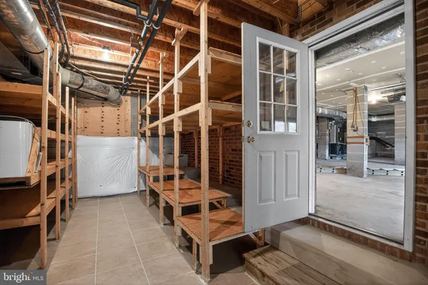 a bathroom with a double vanity sink window and two mirror