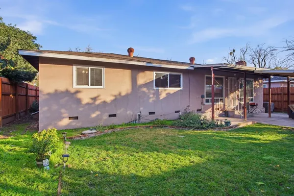 a front view of house with yard and seating area