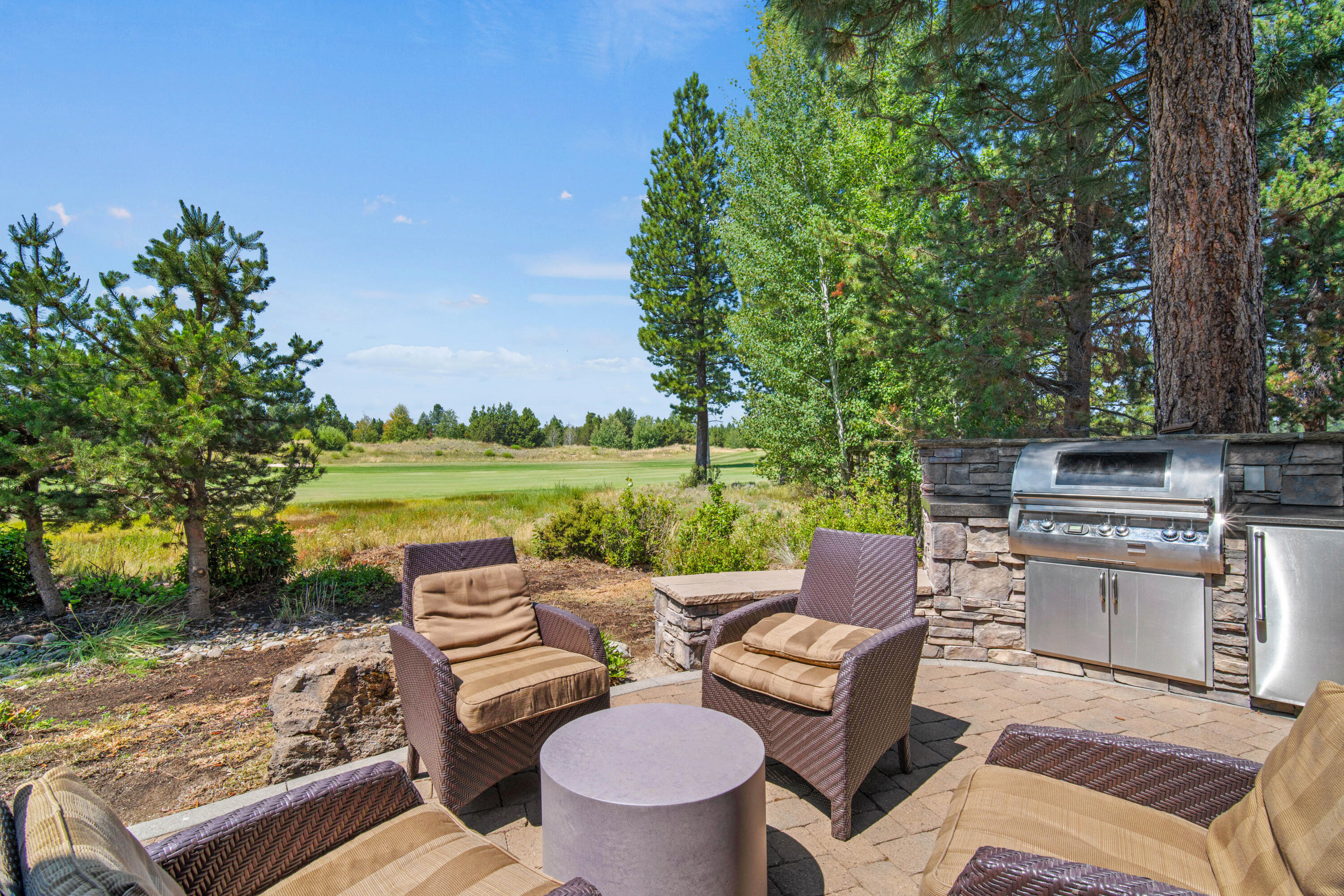 56689 Dancing Rock Loop Bend, OR 97707 - Photo 39 of 51 a view of a patio with furniture and a yard