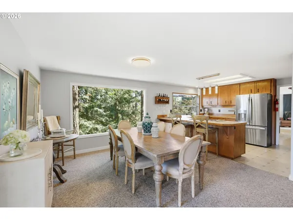 a dinning table and chairs in a kitchen