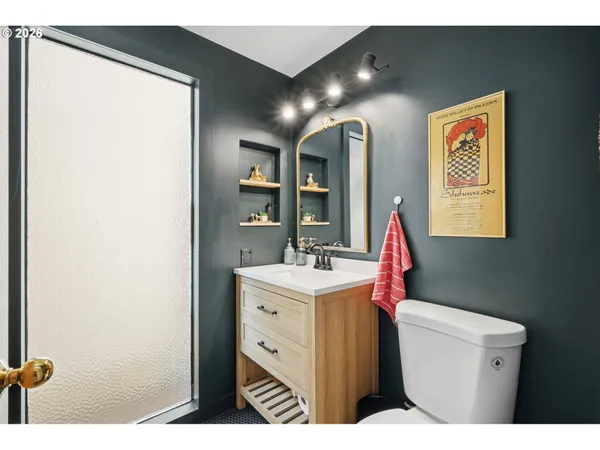 a living room with a bed furniture and a large window