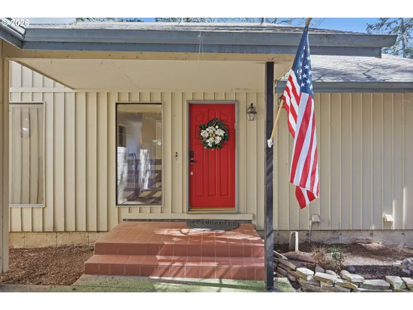 a view of room with window and wooden floor