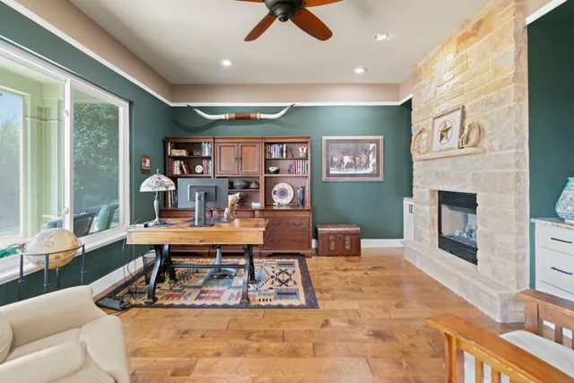 a living room with furniture a rug and a fireplace