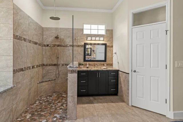 a bathroom with a shower and a sink