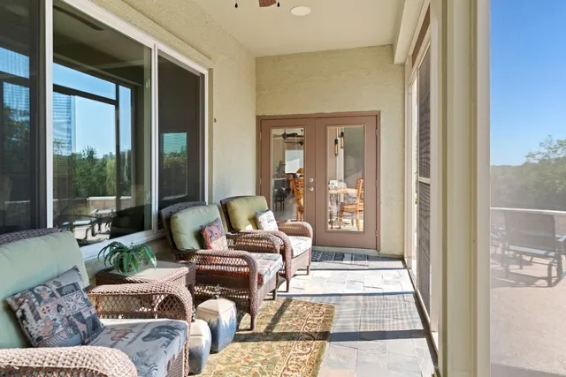 a view of a chairs and table in patio