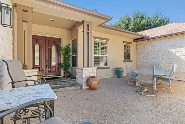 a backyard of a house with seating space
