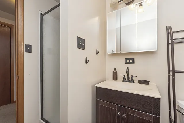 a kitchen with a sink cabinets and a window