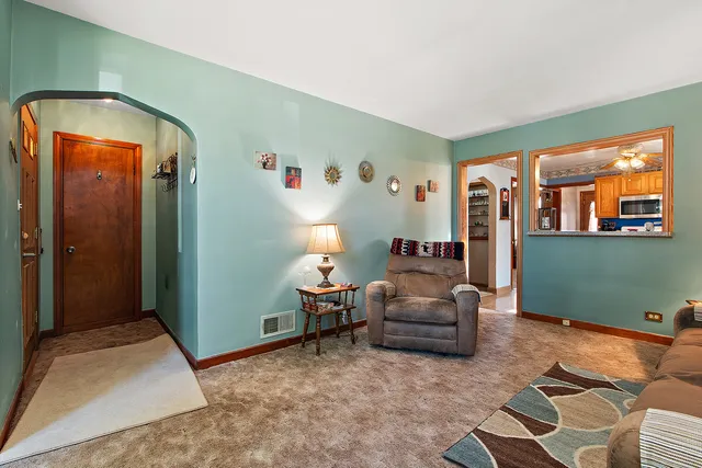 a living room with furniture and a window