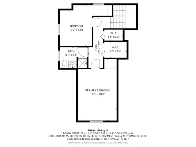 a picture of a bench in front of a wall