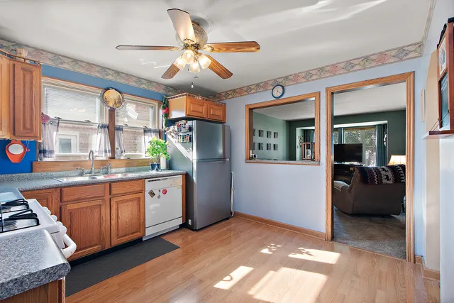 a open kitchen with stainless steel appliances granite countertop a stove and cabinets