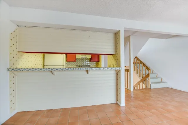 a kitchen with stainless steel appliances granite countertop a stove and a sink