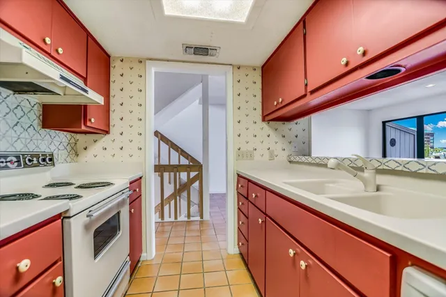 a bathroom with a double vanity sink mirror and shower