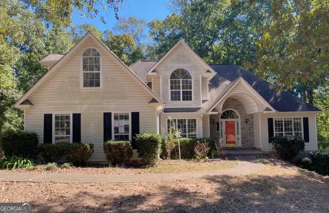 a front view of a house with a yard