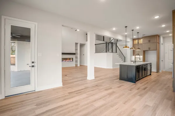 a view of kitchen with furniture and wooden floor