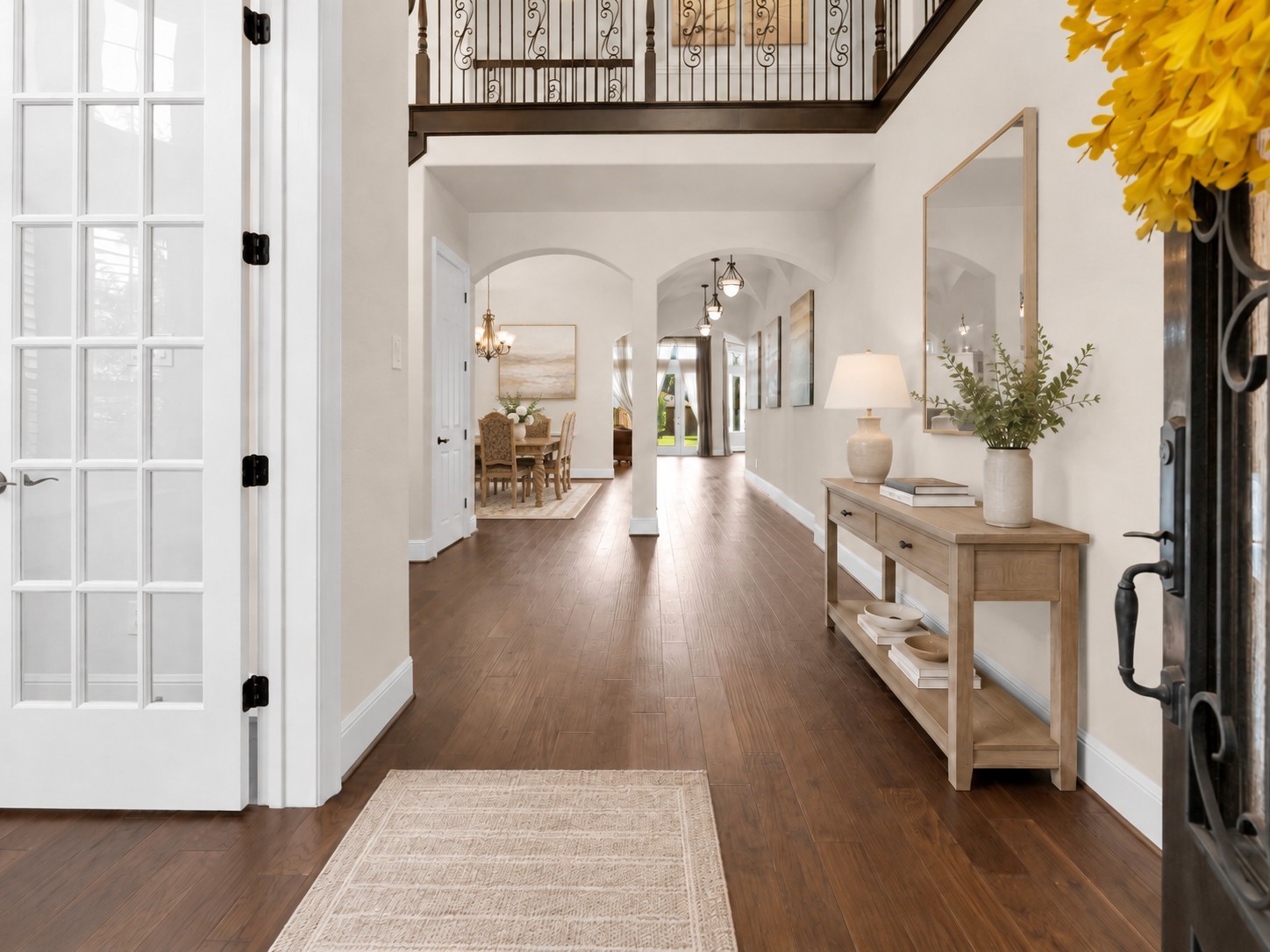 4022 Sabine Valley Trail Spring, TX 77386 - Photo 3 of 46 This welcoming entryway/foyer features elegant hardwood floors, a high ceiling with decorative railing, and a bright, open view leading to a dining area. Virtually staged to show the room’s potential.