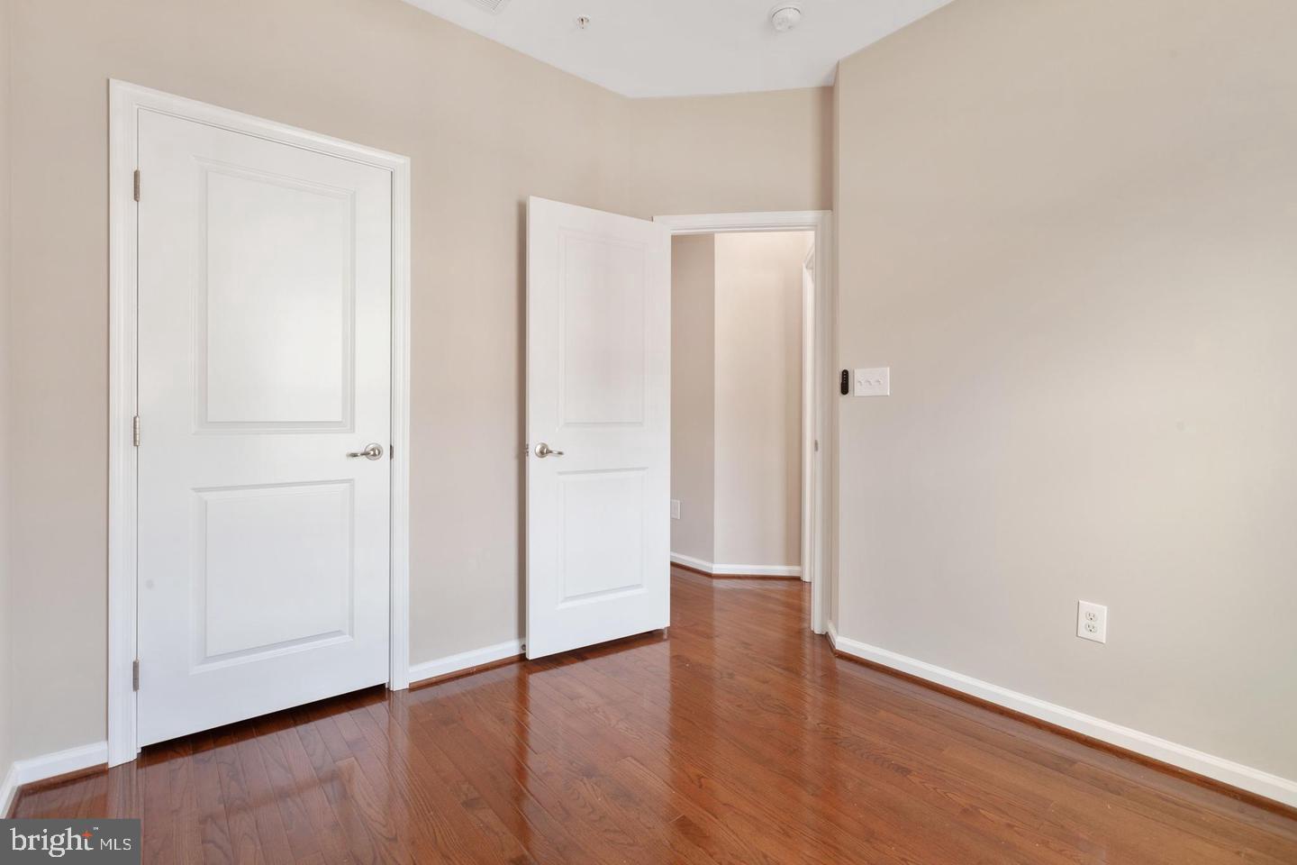 9418 Paragon Court Owings Mills, MD 21117 - Photo 18 of 42 an empty room with wooden floor