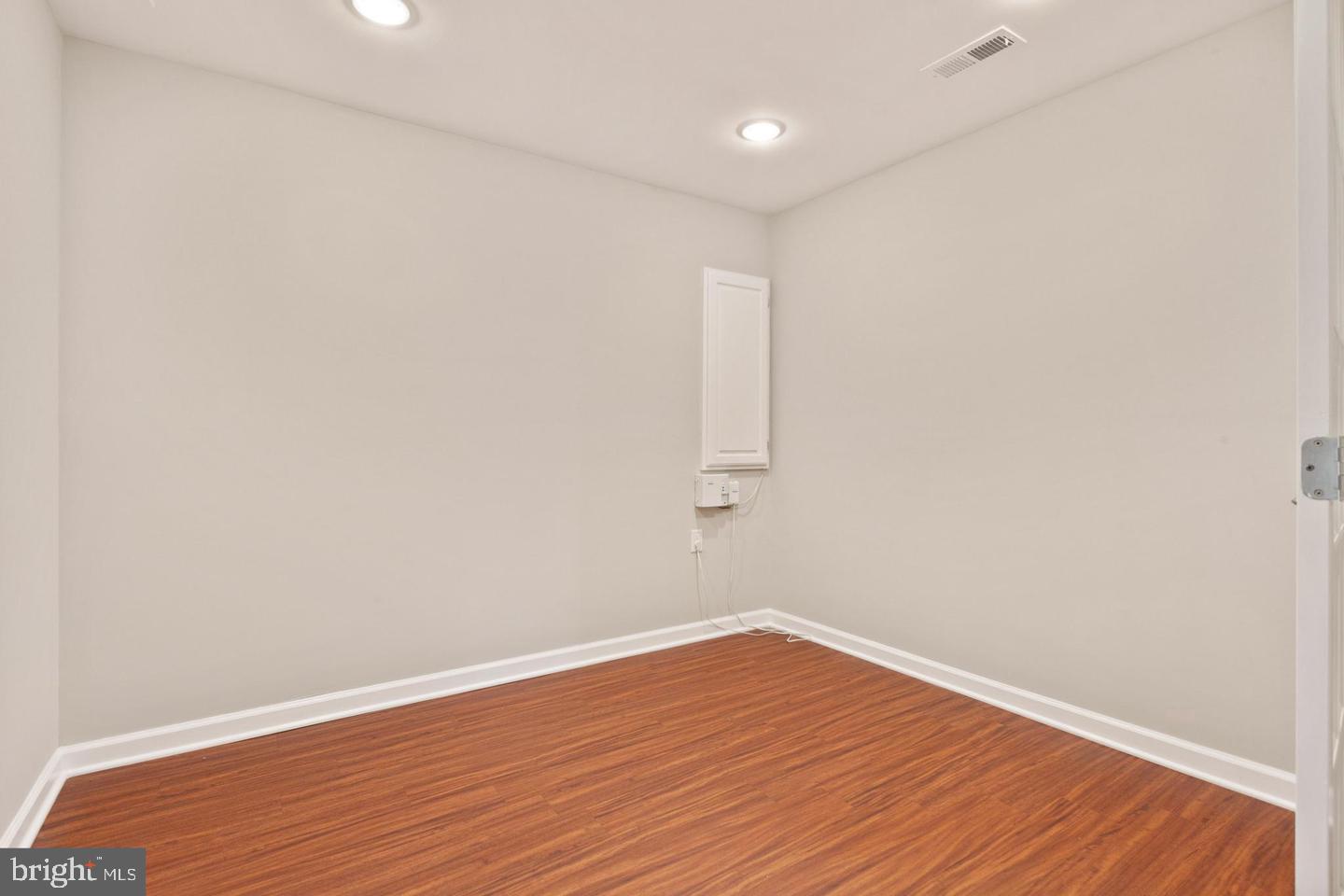 9418 Paragon Court Owings Mills, MD 21117 - Photo 28 of 42 a view of empty room with wooden floor