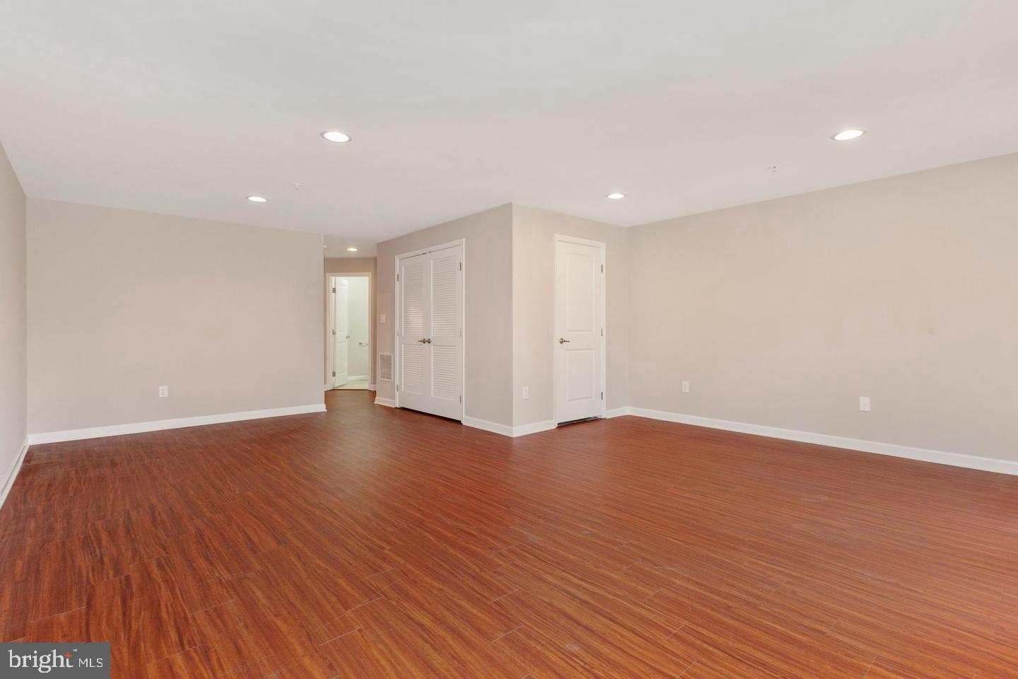9418 Paragon Court Owings Mills, MD 21117 - Photo 32 of 42 a view of an empty room with wooden floor and closet