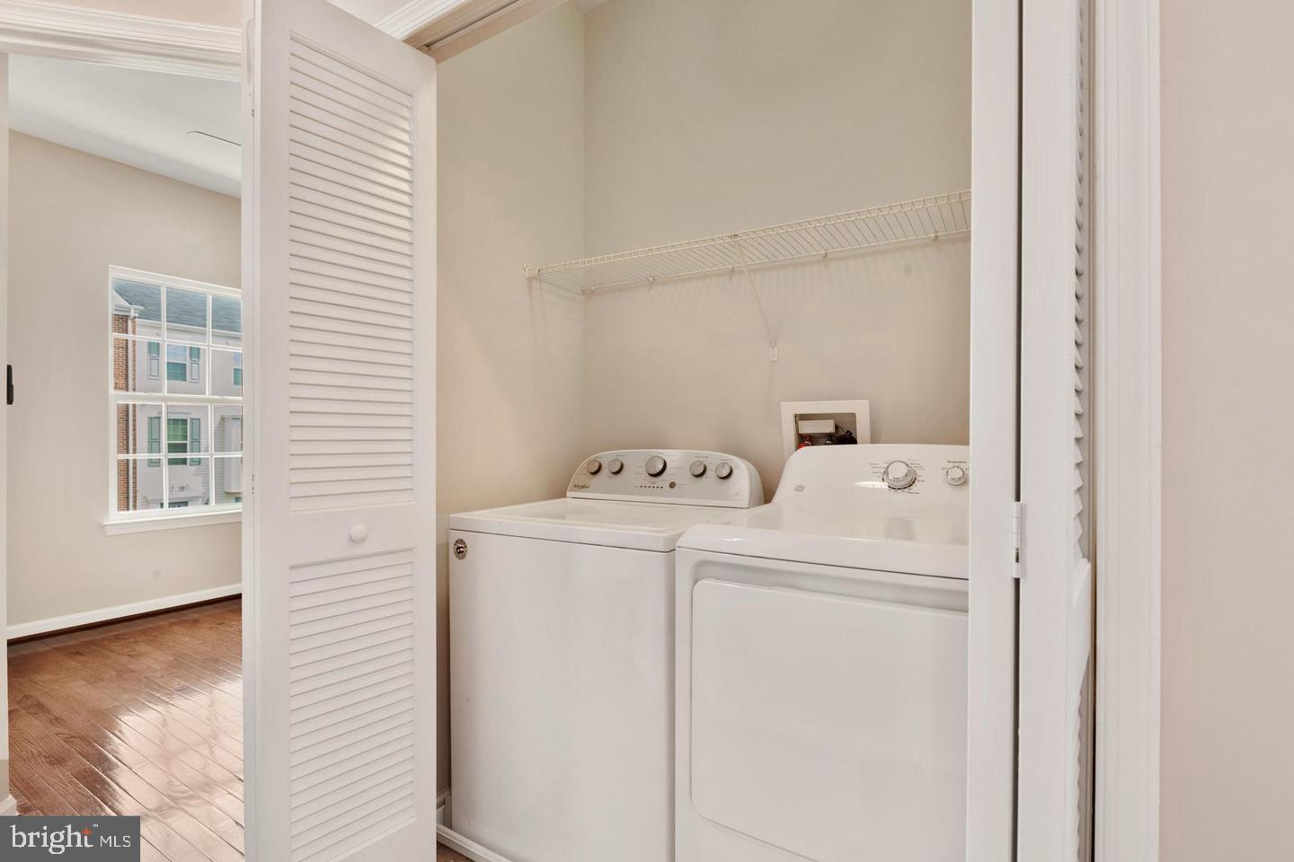 9418 Paragon Court Owings Mills, MD 21117 - Photo 34 of 42 a utility room with dryer and washer