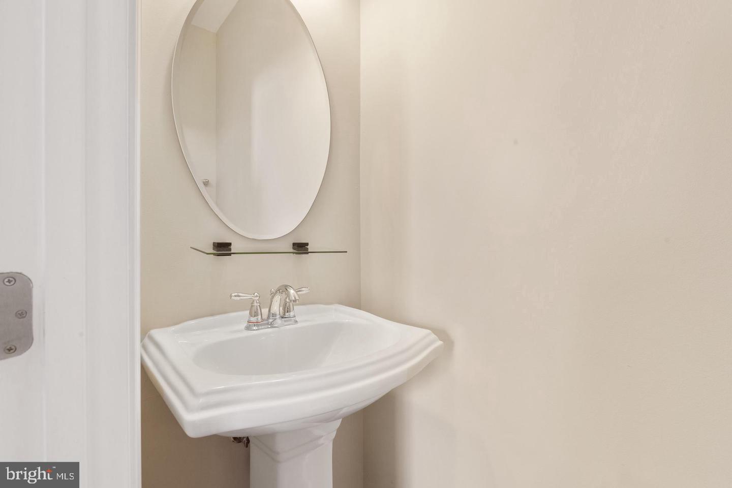 9418 Paragon Court Owings Mills, MD 21117 - Photo 36 of 42 a bathroom with a sink and a mirror