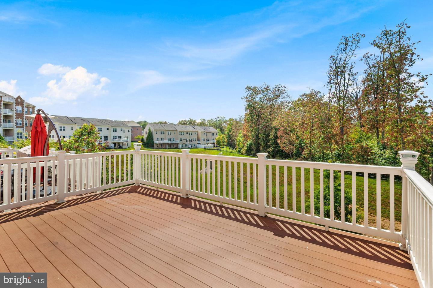 9418 Paragon Court Owings Mills, MD 21117 - Photo 41 of 42 a balcony with wooden floor and fence