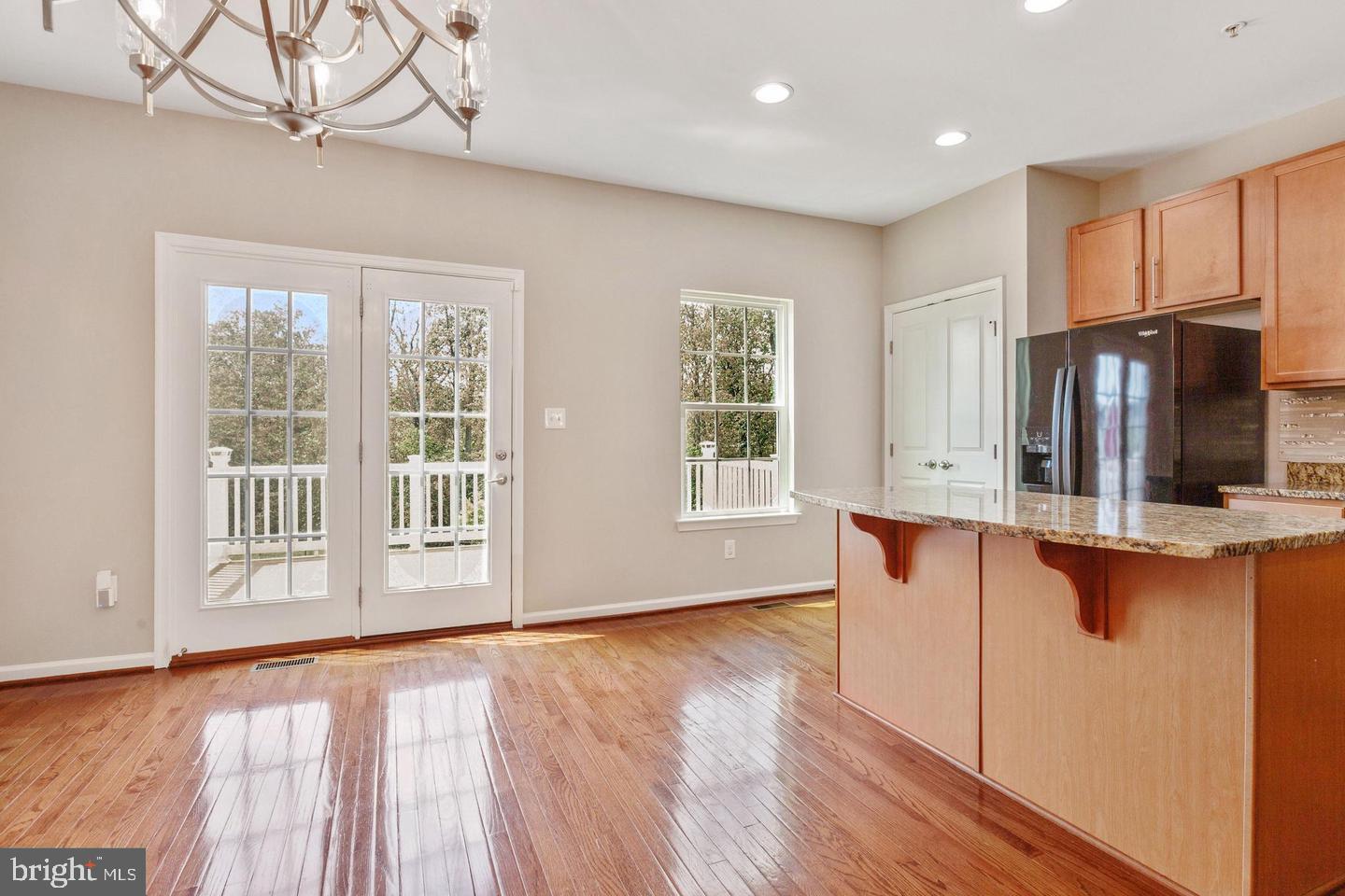 9418 Paragon Court Owings Mills, MD 21117 - Photo 9 of 42 a view of kitchen with furniture and wooden floor