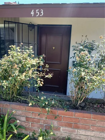 a house with a tree in front of it
