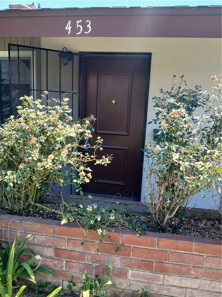453 East 1st Street Tustin, CA 92780 - Photo 1 of 16 a house with a tree in front of it