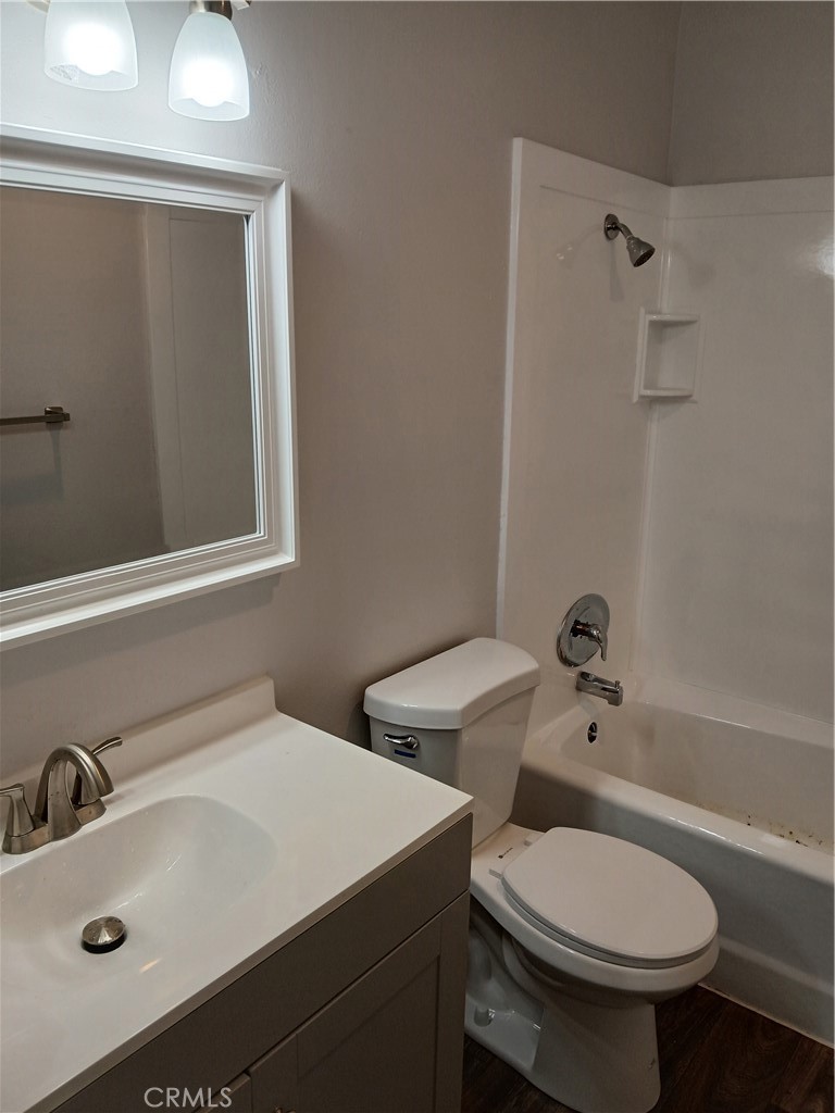 453 East 1st Street Tustin, CA 92780 - Photo 11 of 16 a bathroom with a sink toilet and shower