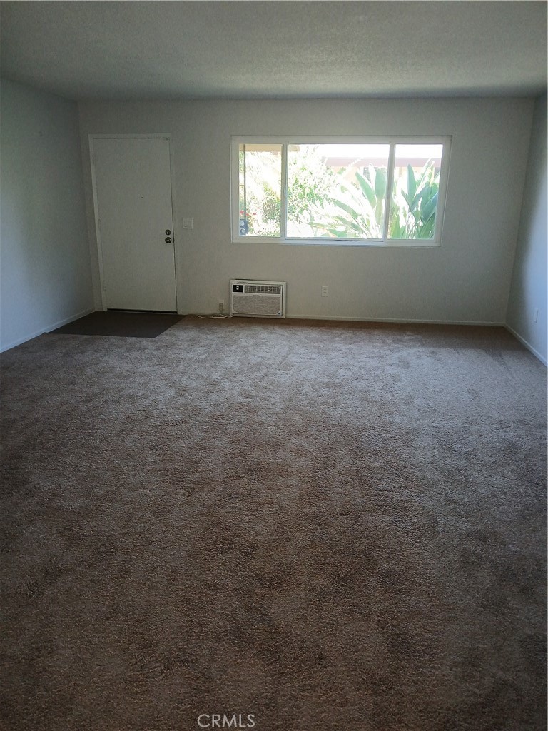 453 East 1st Street Tustin, CA 92780 - Photo 2 of 16 an empty room with large windows
