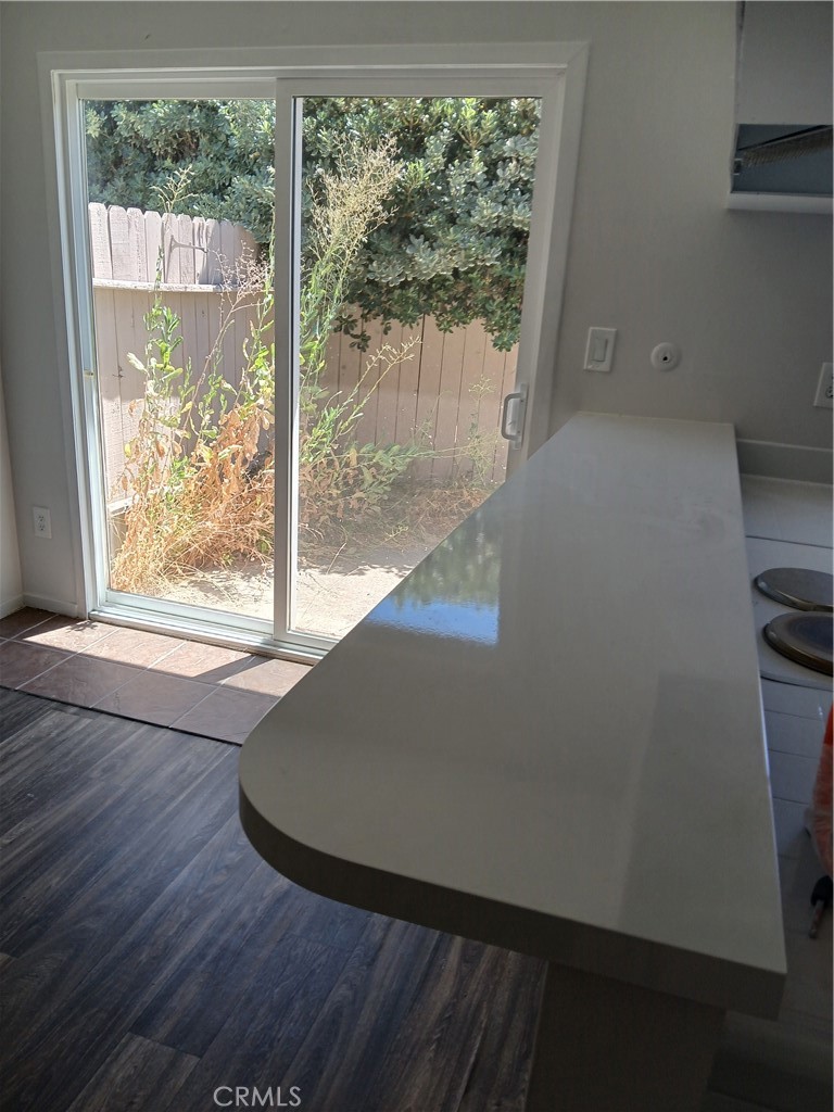 453 East 1st Street Tustin, CA 92780 - Photo 8 of 16 a view of a small space with wooden floor and a sink