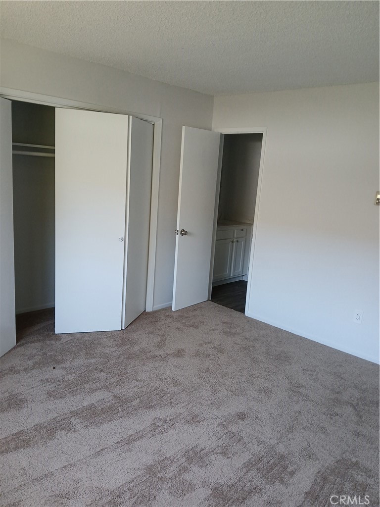 453 East 1st Street Tustin, CA 92780 - Photo 9 of 16 a view of an empty room with wooden floor and closet