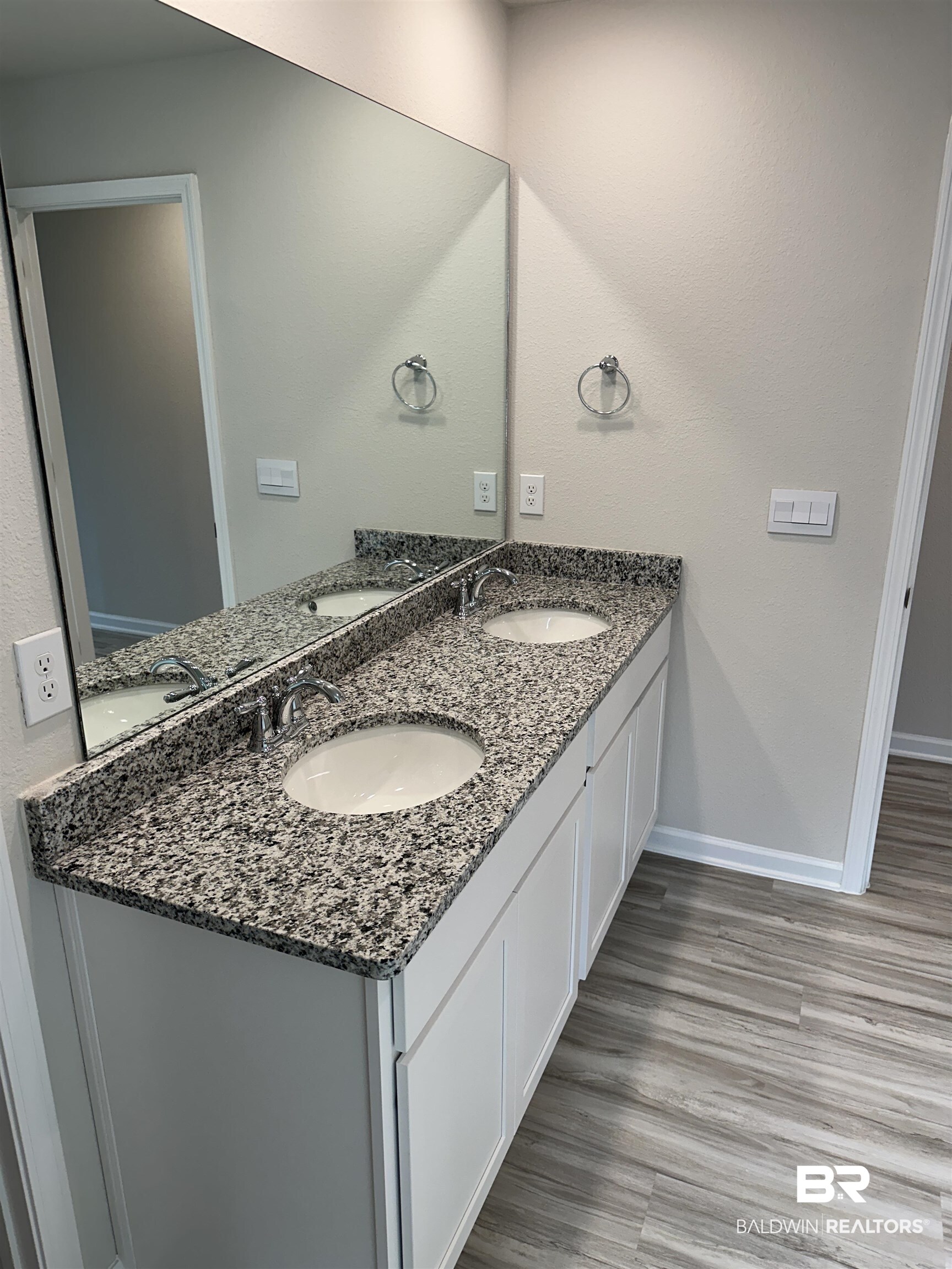 8850 Sea Star Circle Foley, AL 36535 - Photo 17 of 29 Bathroom with vanity and wood-type flooring
