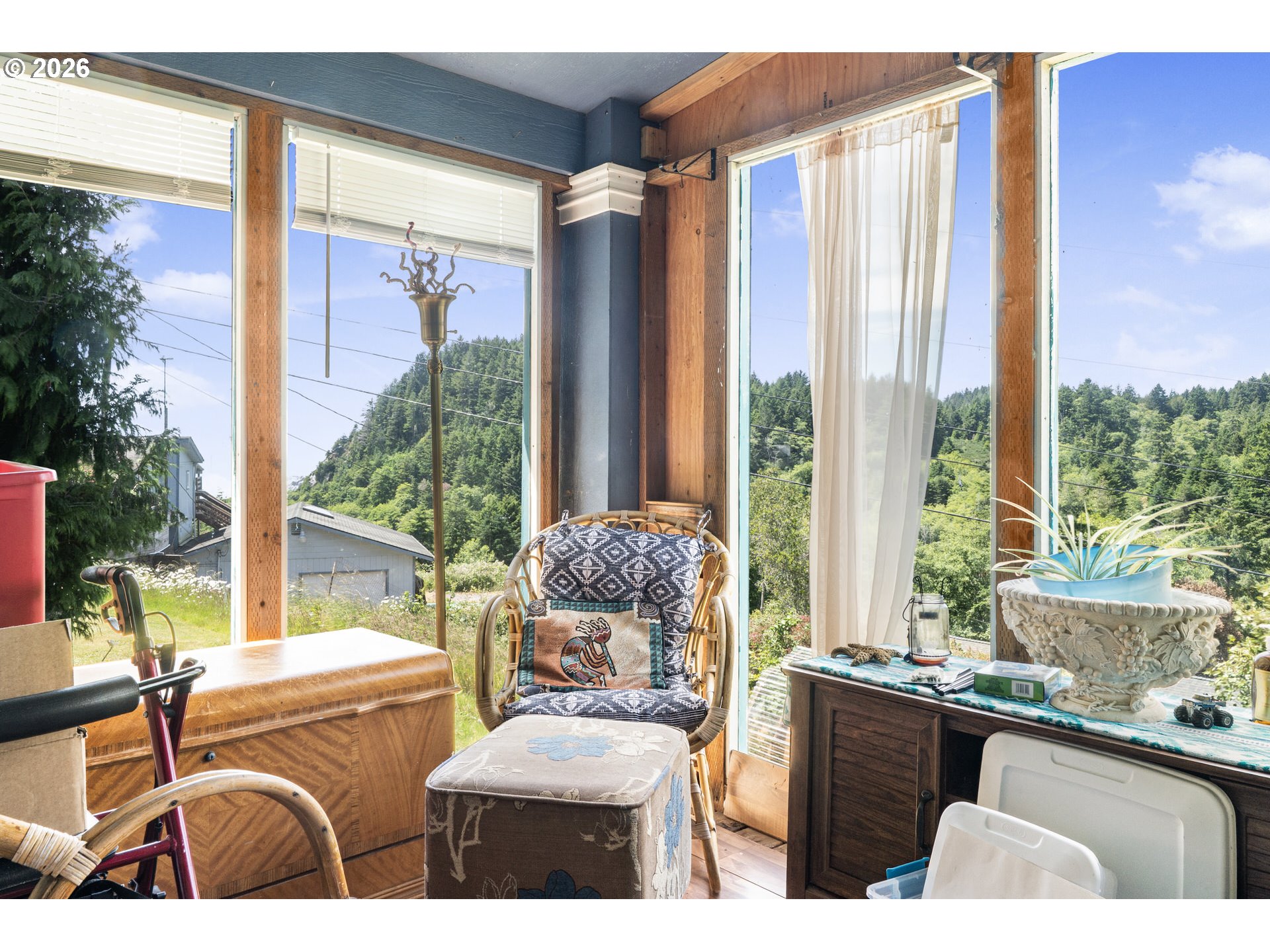 96465 Coverdell Road, Unit 8 Brookings, OR 97415 - Photo 4 of 16 a living room filled with furniture and large windows
