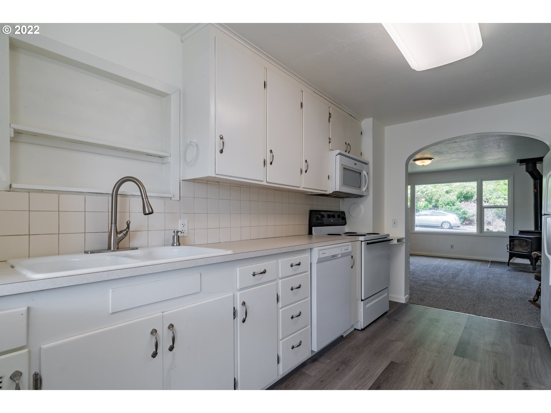2175 City View Street Eugene, OR 97405 - Photo 9 of 32 a kitchen with sink and cabinets