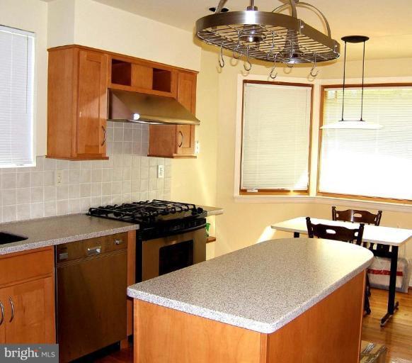 9105 Brierly Road Chevy Chase, MD 20815 - Photo 5 of 12 Kitchen with Maple Cabinetry, Corian & Stainless