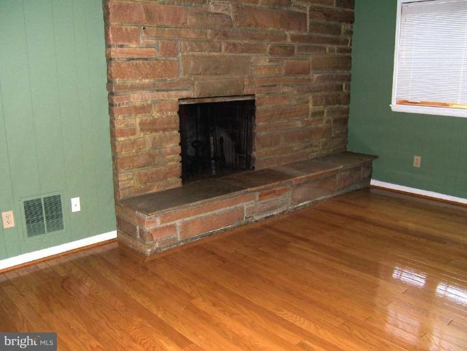9105 Brierly Road Chevy Chase, MD 20815 - Photo 8 of 12 Light-Filled Family Room with Fireplace