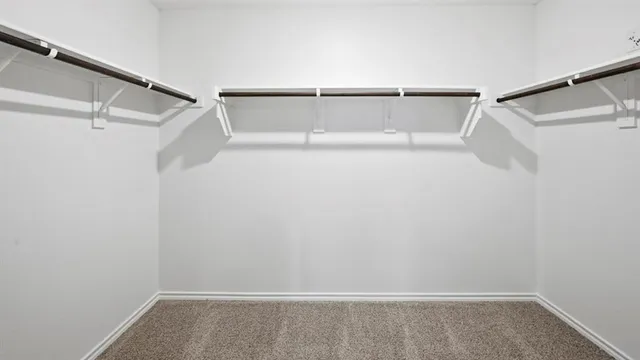 a kitchen with stainless steel appliances a sink a stove a microwave a counter top and cabinets