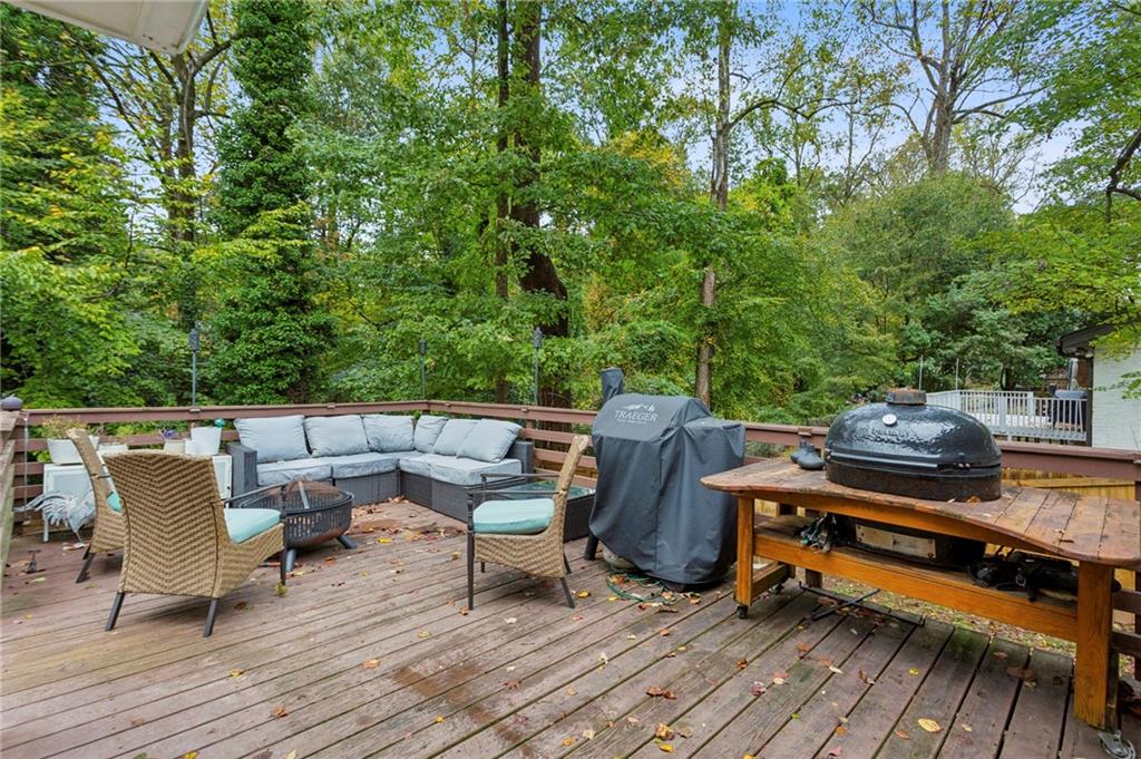 2592 Woodacres Road Northeast Atlanta, GA 30345 - Photo 23 of 27 a view of a roof deck with wooden floor and outdoor seating