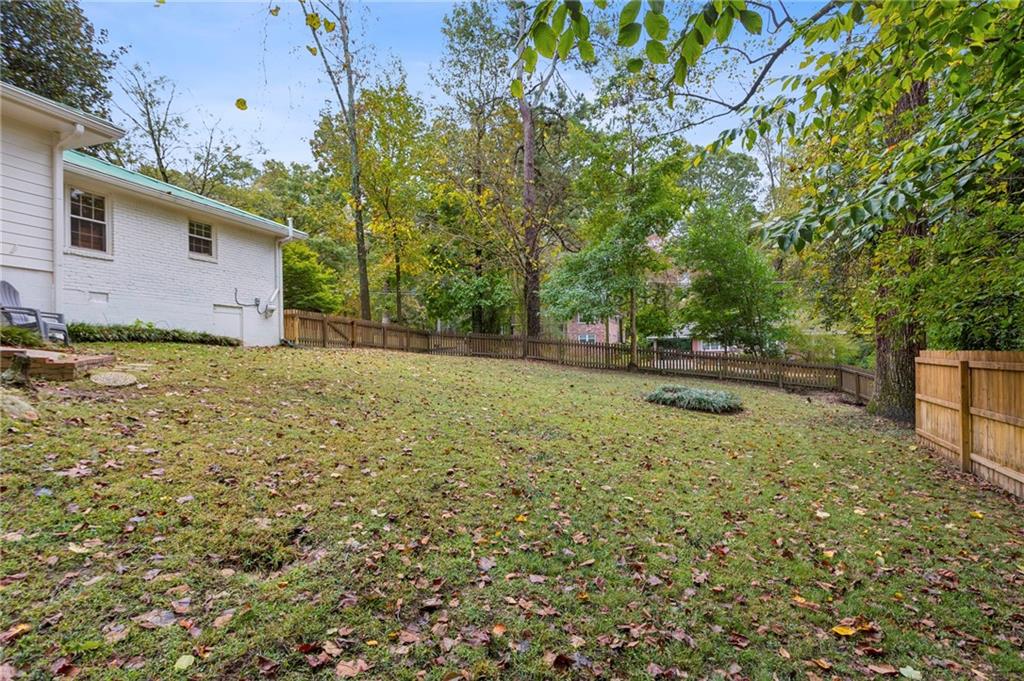 2592 Woodacres Road Northeast Atlanta, GA 30345 - Photo 27 of 27 a backyard of a house with lots of green space
