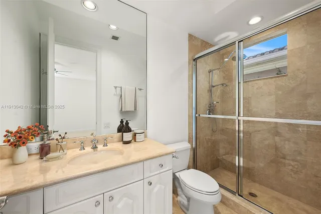 a bedroom with a bed and a potted plant