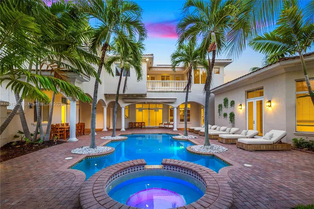 a view of a swimming pool with chairs